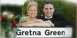 Wedding Couple at the Gretna Green Sign